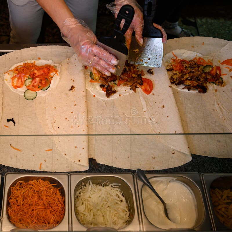 The Cook Prepares Shawarma from Vegetables and Meat, Four Sheets of