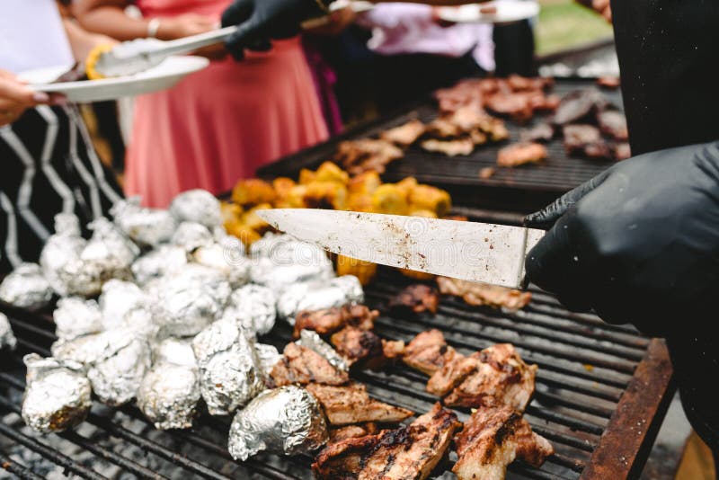 Cook Preparing Grilled Meat during a Barbecue Stock Image Image of
