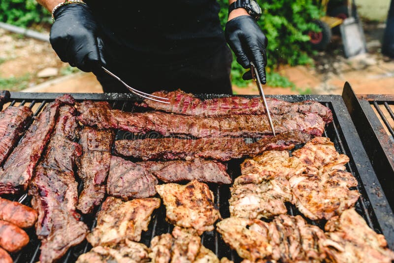 Cook Preparing Grilled Meat during a Barbecue Stock Image Image of