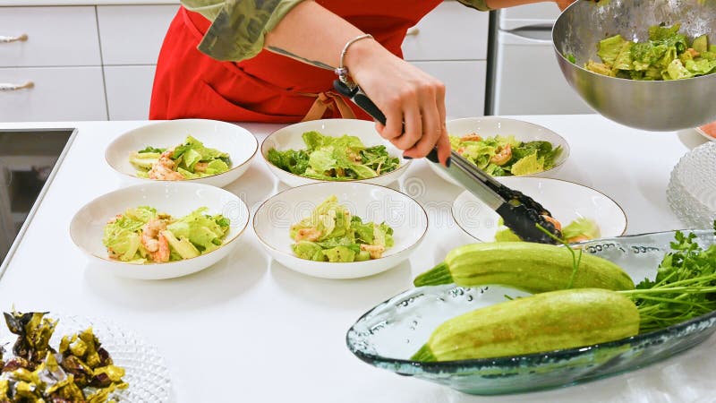 The Cook Spreads The Cooked Salad. Vegetarian Food. Cook In The Kitchen