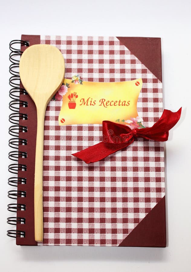 The book of recipes with a wooden spoon and a red bow. Vintage rustic recipe book background stock images, royalty-free photos and pictures