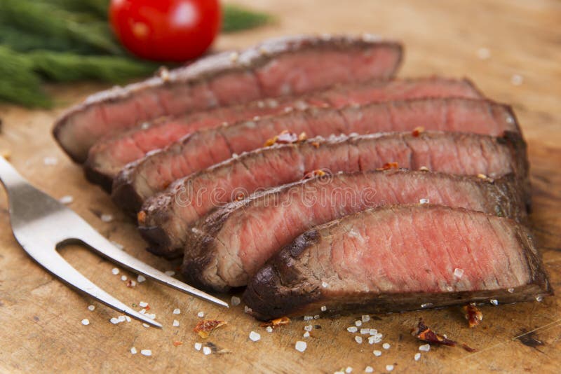 Cooked beef steak sliced medium rare close-up