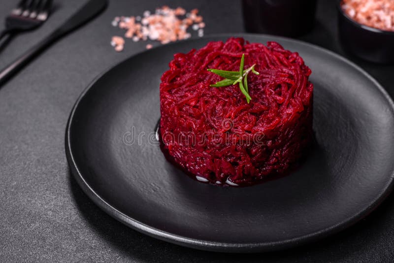 Cooked Grated Beetroot Formed As a Cylinder and Ready Dish on a Black ...