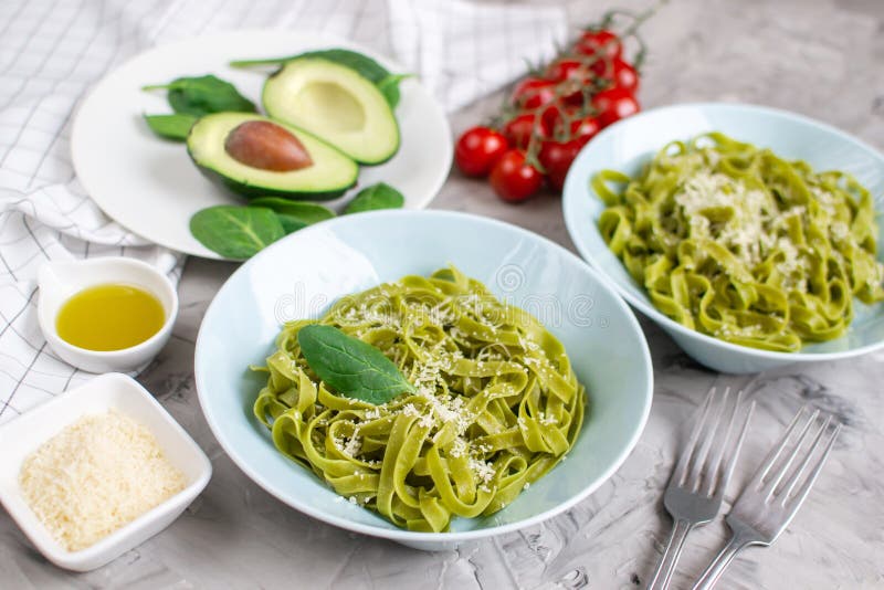 Cooked Green Spinach Tagliatelle Pasta on a Plate with Parmesan Cheese ...