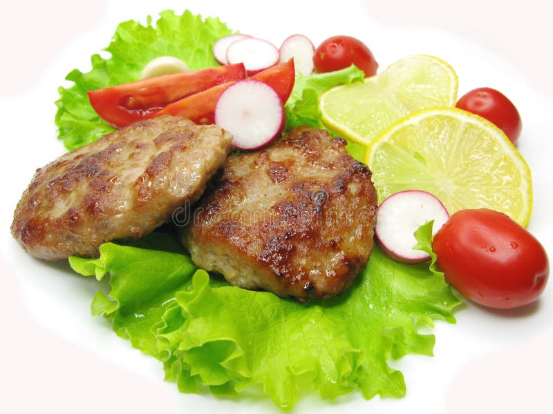 Cooked meat cutlets with vegetables royalty free stock photos