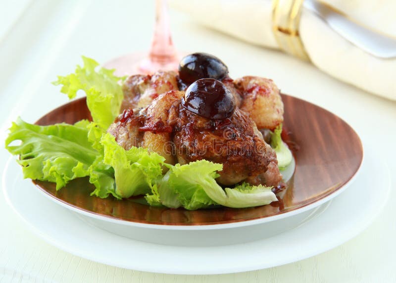Cooked meat duck with berry sauce and salad
