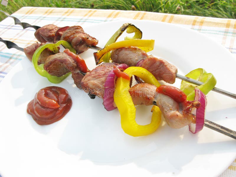 Cooked meat with vegetables stock images