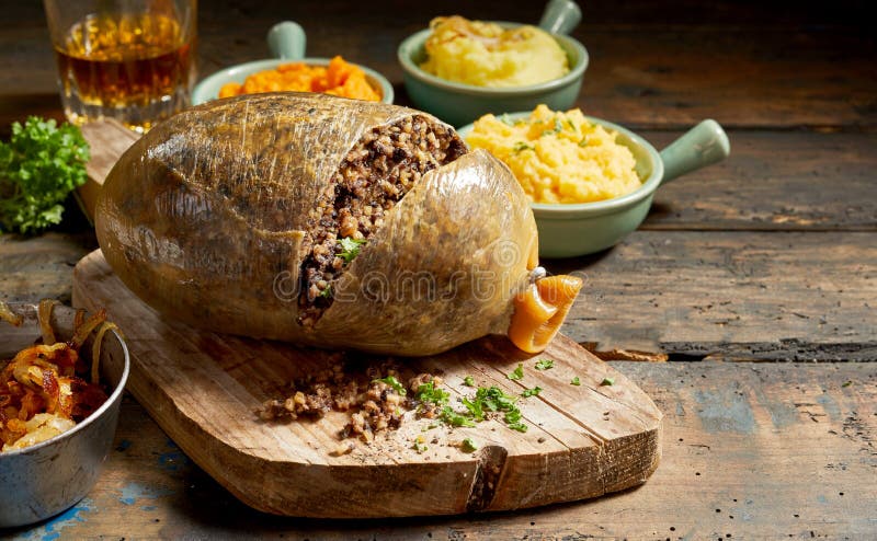 Cooked sliced open haggis and vegetables stock images