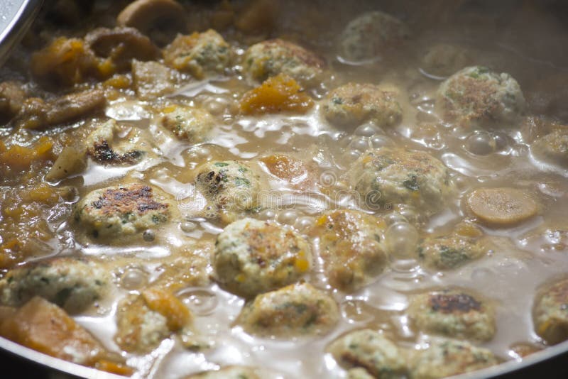 Cooked Turkey Meatballs in a Boiling Vegetables Soup Stock Image