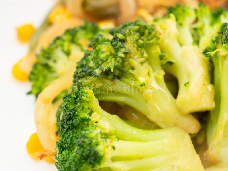 Cooked Vegetables Broccoli, Carrots, Green Beans, Corn on a White Plate