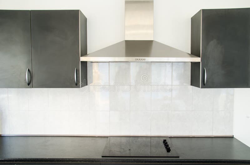 Cooker hood in kitchen room at home