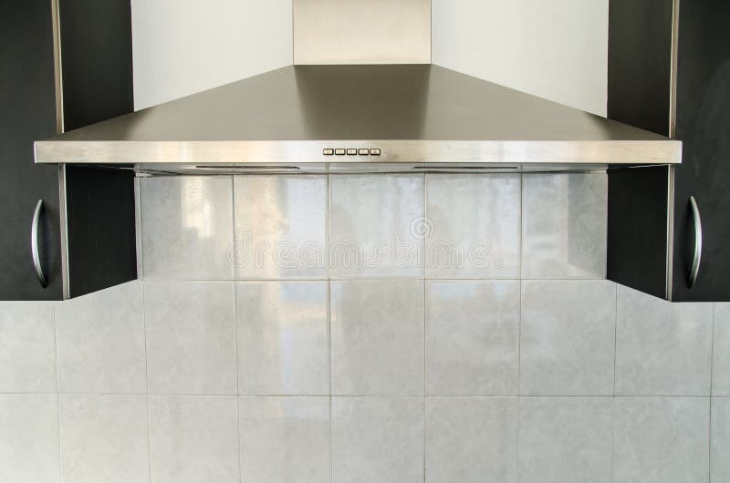 Cooker hood in kitchen room at home