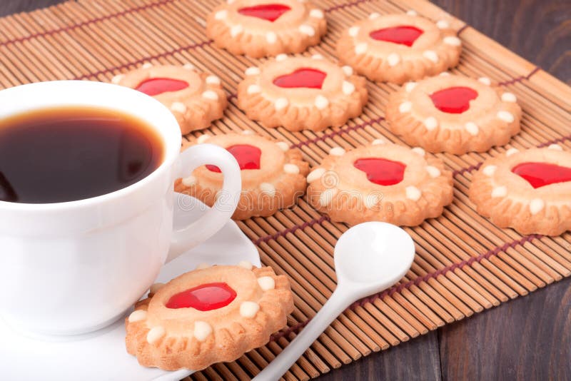 Cookie with Heart Jelly and Cup of Coffee Bamboo Napkin Stock Image