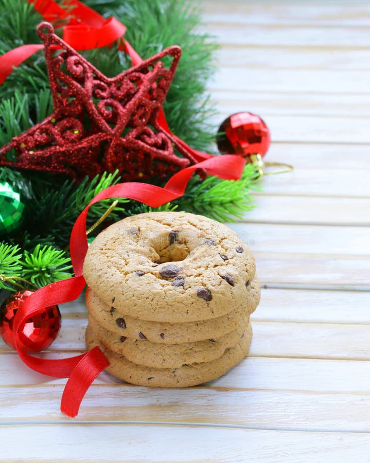 Cookies with chocolate with Christmas tree branches and decorations