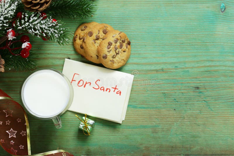 Cookies and a glass of milk for Santa. Christmas stock photo Cookies and a glass of milk for Santa. Christmas stock photo