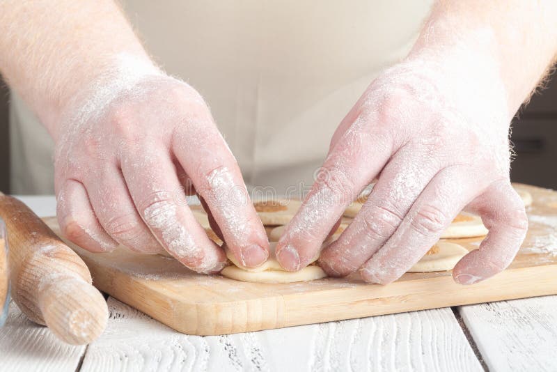 Cookies, Production of flour products. Hands close-up stock images