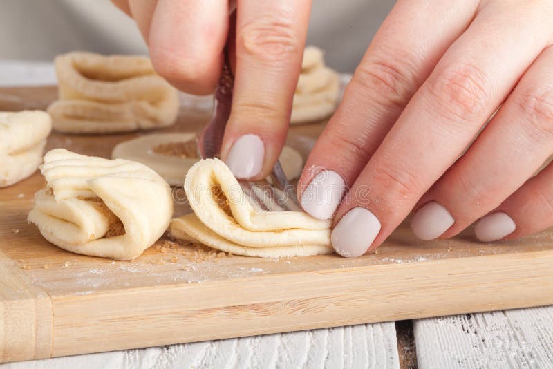 Cookies, Production of flour products. Hands close-up royalty free stock image