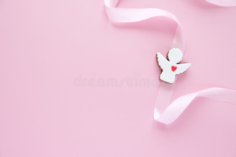 Cookies in the Shape of an Angel with Pink Ribbon on Pink Background. Stock Photo - Image of pleasant, delicious: 195905270 Cookies in the Shape of an Angel with Pink Ribbon on Pink Background. Stock Photo - Image of pleasant, delicious: 195905270