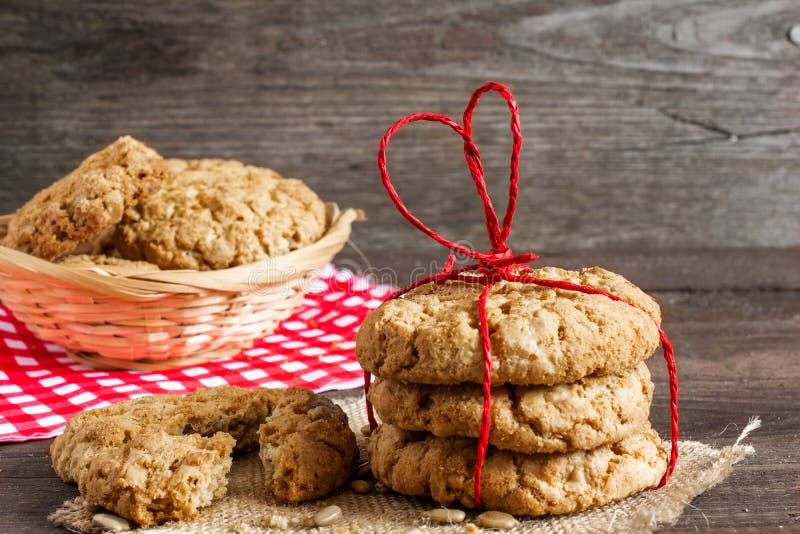 Cookies for Valentine`s Day with red heart shaped ribbon