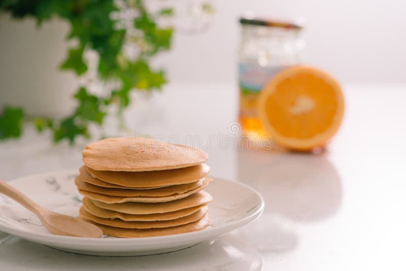 Cooking for breakfast. Delicious homemade pancakes on a plate