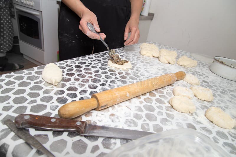 Cooking cakes of the dough in the kitchen