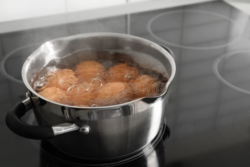Cooking Chicken Eggs in Pot on Electric Stove. Stock Photo Image of dinner, preparing 141599170