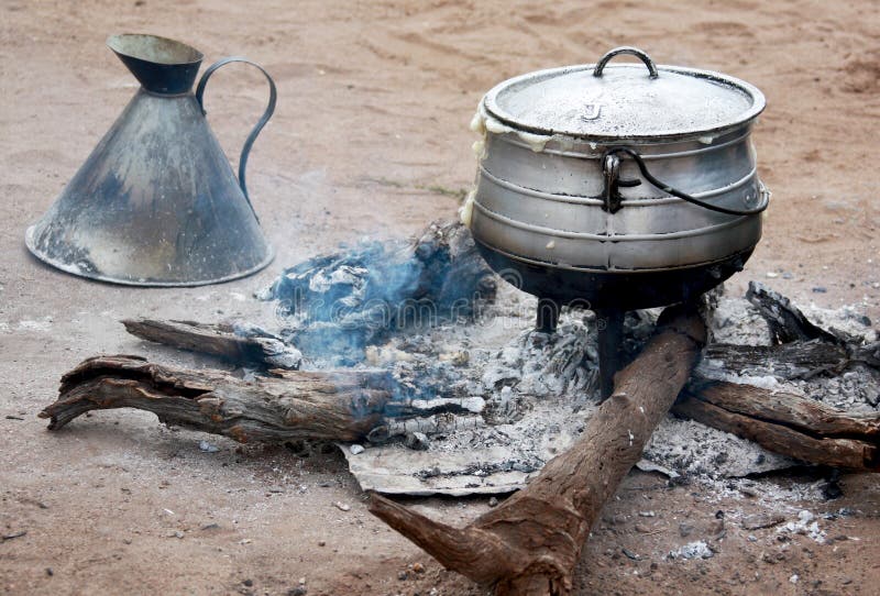 Cooking Corn Cereal in Contrule on Fire in the Village, Stock Photo