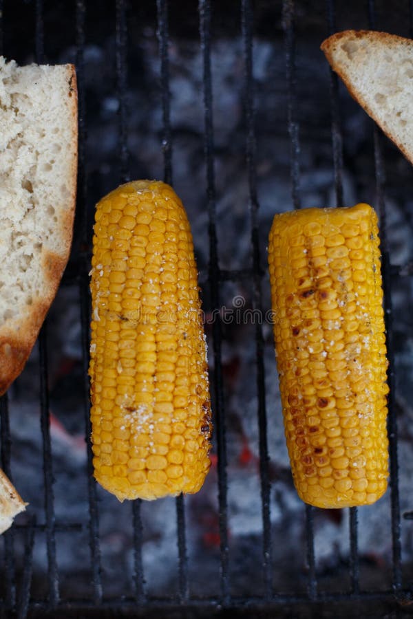 Cooking Corn on the Cob on the Grill, Outside the House Stock Image