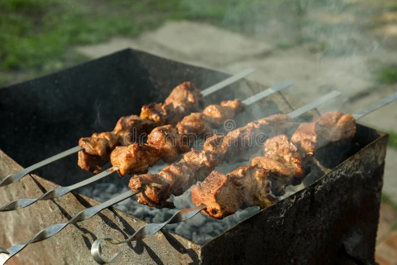 Cooking Delicious Meat on Metal Brazier Outdoors Stock Image - Image of ...