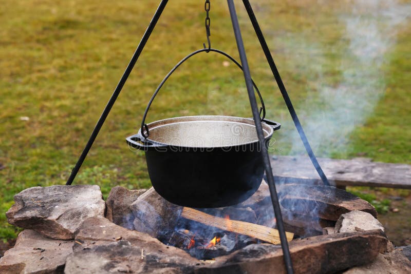 Cooking Food on Campfire Outdoors. Camping Season Stock Photo Image