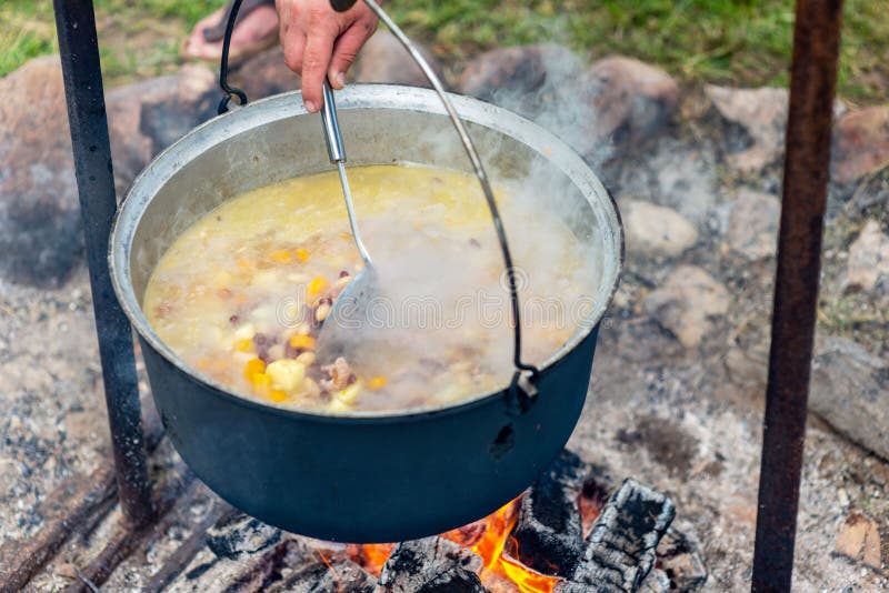 Cooking Food in a Pot on Campfire. Summer Camping Concept Stock Image ...