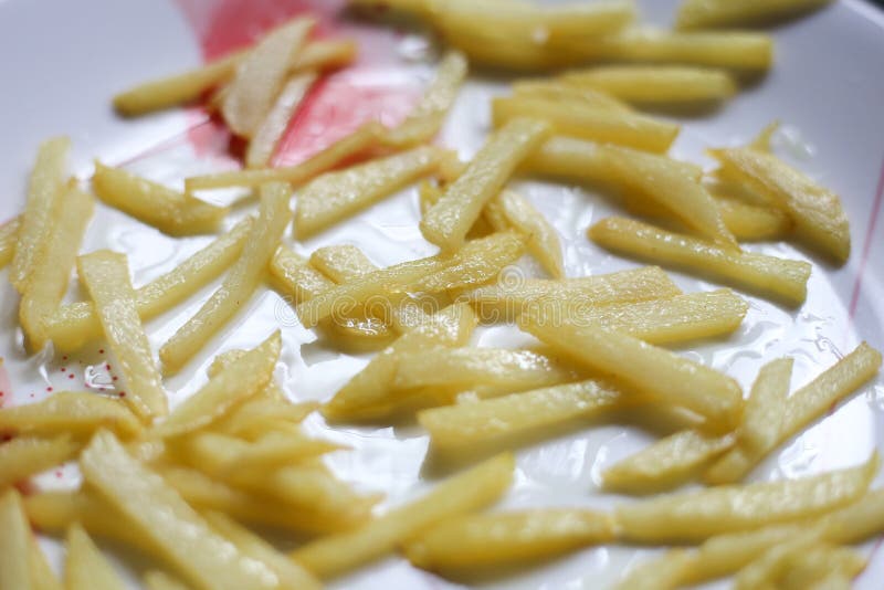 Cooking French Fries in the Deep Fryer, Homemade French Fries Stock