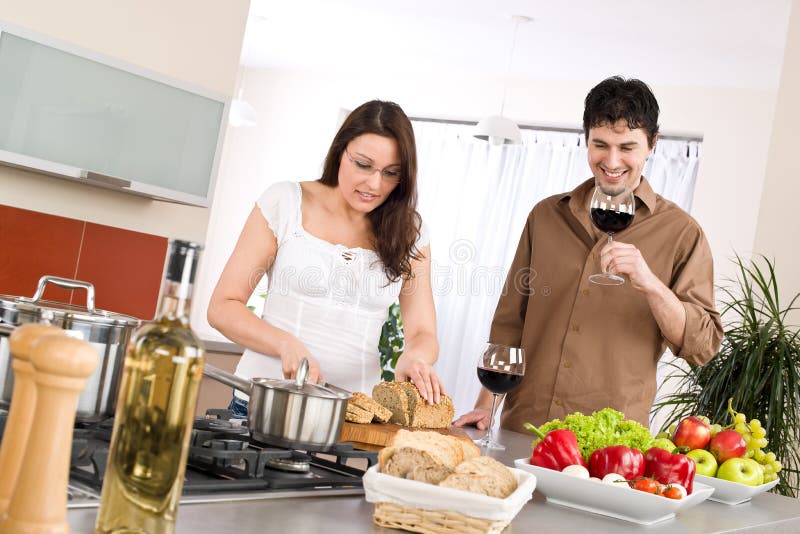 Cooking - happy couple together in modern kitchen