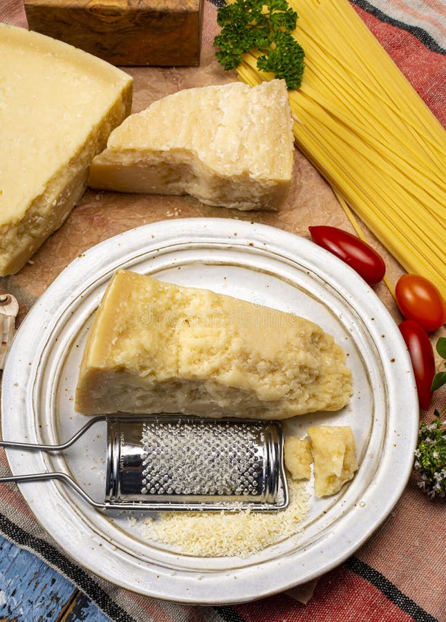 Man Cooking With Hard Italian Cheese Grated Parmesan Or Grana Padano Cheese  Hand With Grater Stock Photo - Download Image Now - iStock