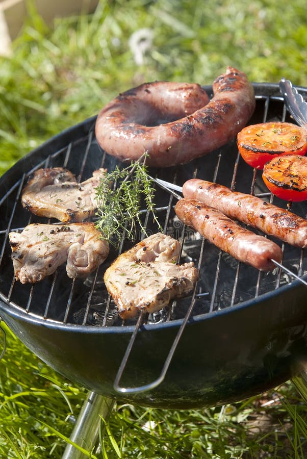 BBQ. Cooking Barbecue Steak And Sausages On The Old Grill In The ...