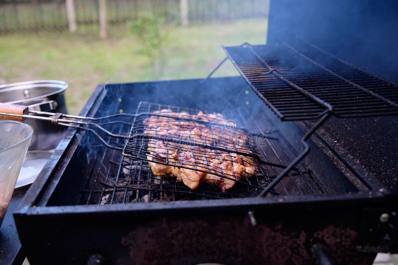 Cooking Meat on the Grill on the Coals on the Barbecue Stock Photo