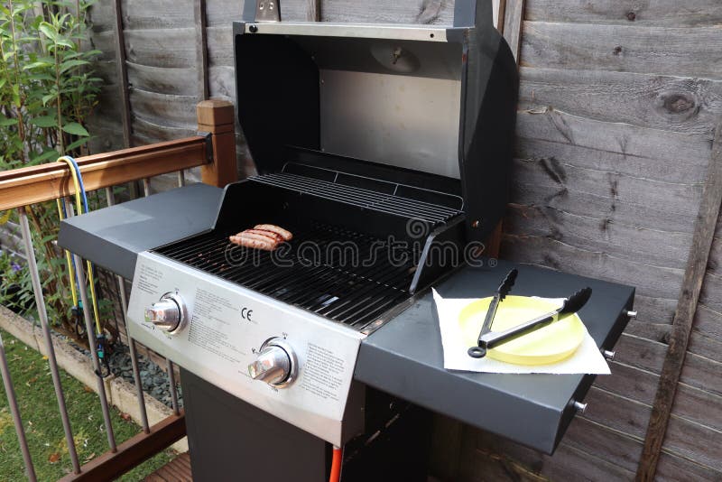 Cooking meat outdoors on a gas flamed bbq