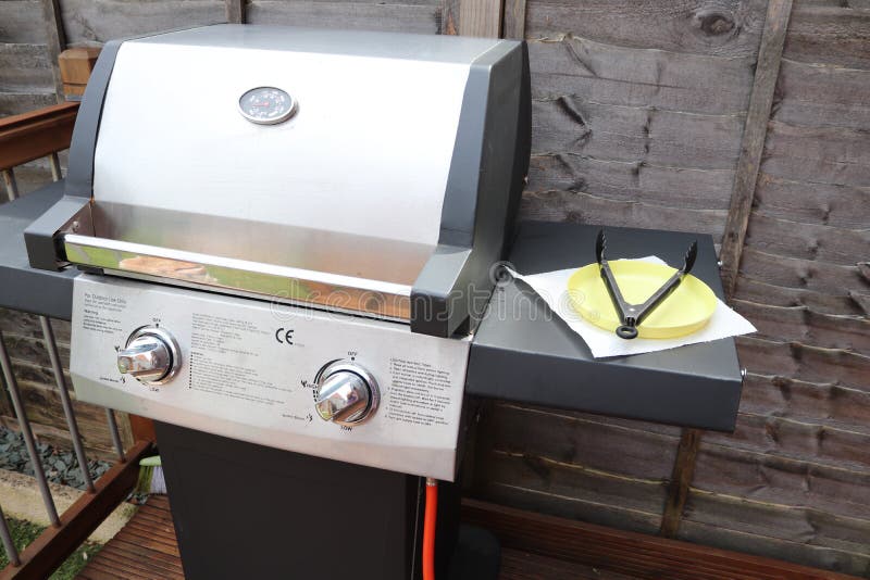 Cooking meat outdoors on a gas flamed bbq