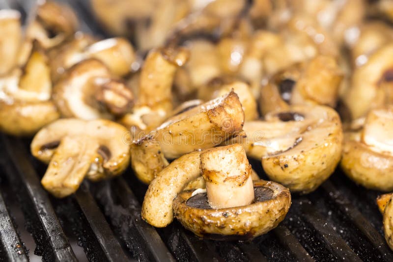Cooking mushrooms on grill stock photo. Image of ingredients 31785496