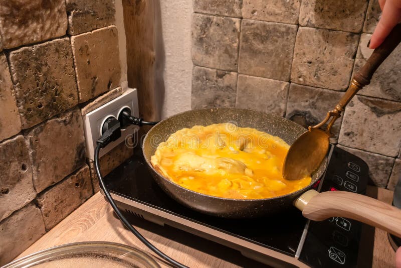 Cooking Omelet in a Pan on an Electric Stove Stock Image Image of