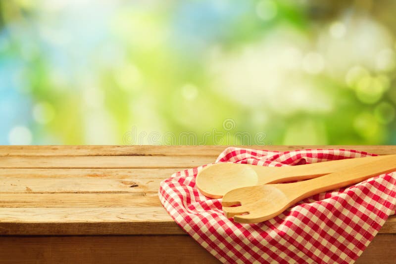 Cooking outdoor background with wooden spoons