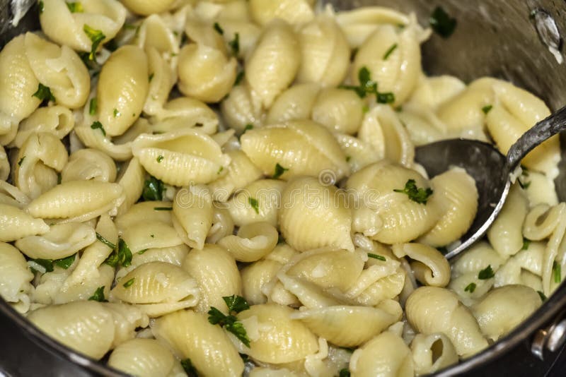 Cooking pasta in a pan stock image. Image of preparing 179476281