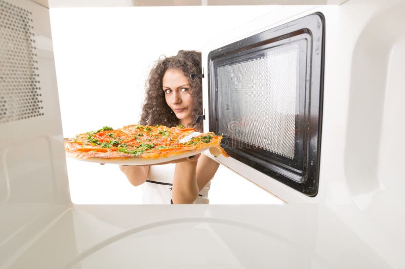 Cooking Pizza In The Microwave Stock Image - Image of casual