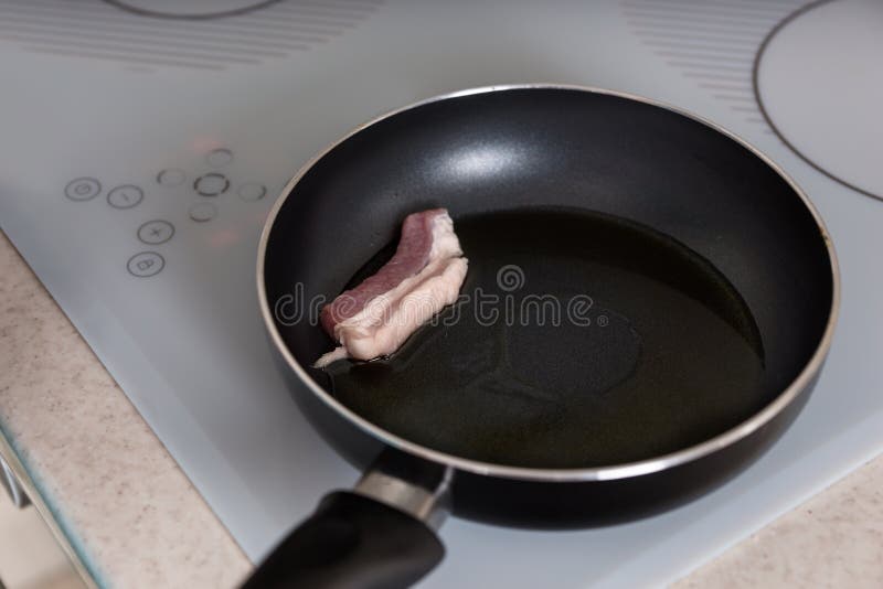 https://thumbs.dreamstime.com/b/cooking-pork-meat-frying-pan-oil-close-up-using-automatic-burner-stove-kitchen-59614610.jpg