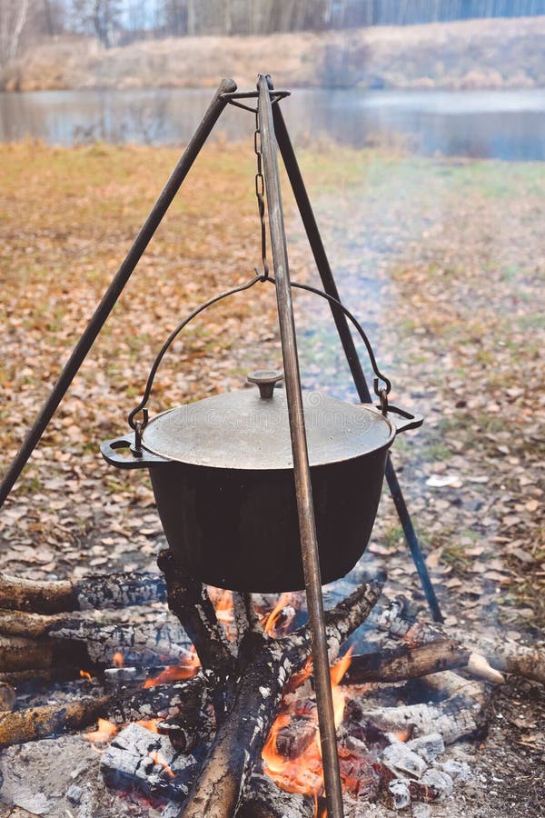 Cooking in Pot on Campfire, Camp Cooking, Pot with Hot Food Stock Photo