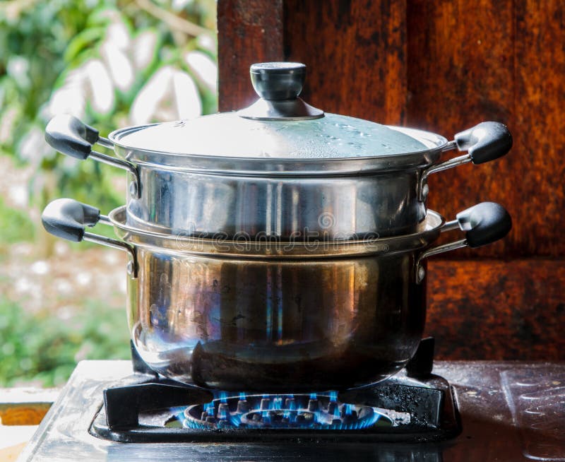 Cooking pot on the stove Stock Photo by ©eskaylim 118705498