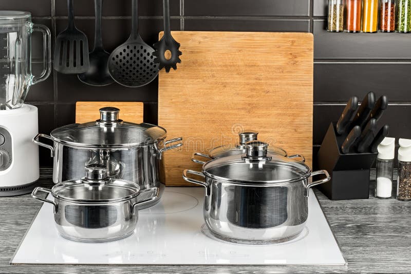 https://thumbs.dreamstime.com/b/cooking-pots-kitchen-white-induction-hob-stainless-steel-cooking-pots-kitchen-white-induction-hob-food-cooking-114277710.jpg