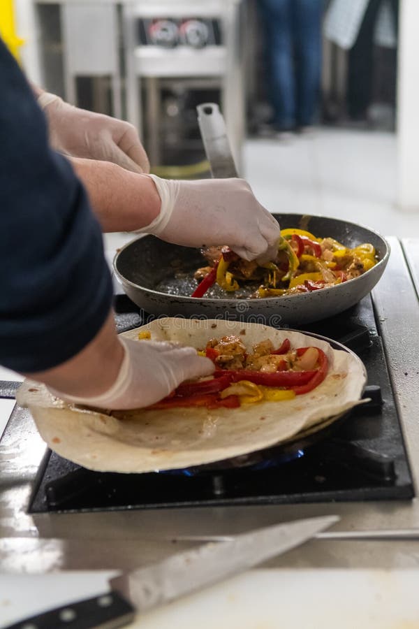 Cooking Process of Quesadilla with Pans with Two Cook Stock Image