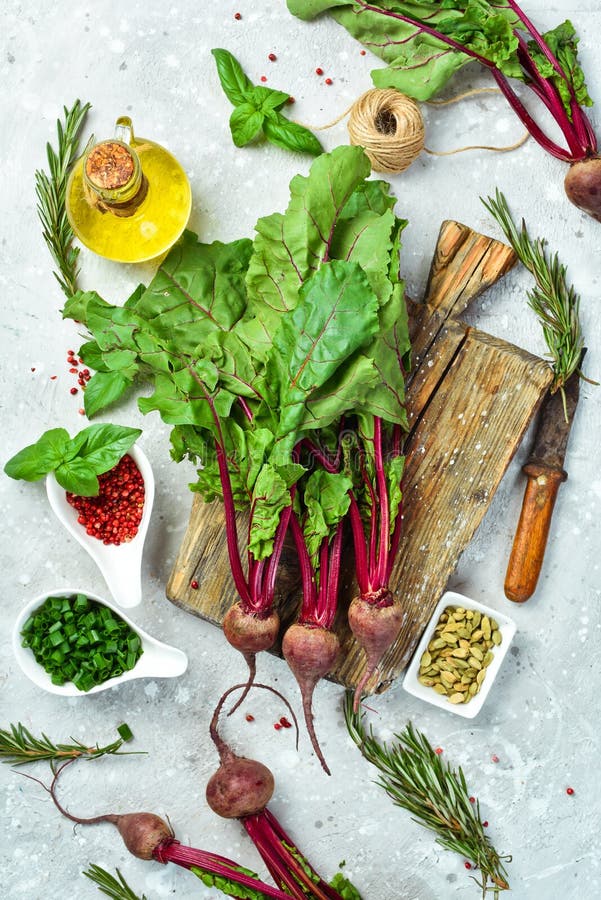 Cooking. Red Beets with Young Leaves on a Kitchen Background Stock