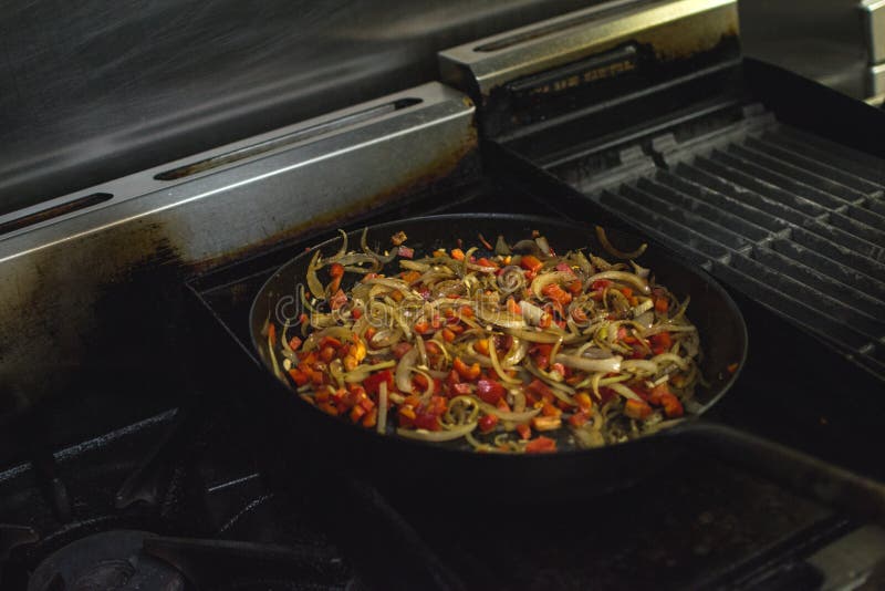 Cooking in a Restaurant Onion and Red Pepper. Stock Image Image of